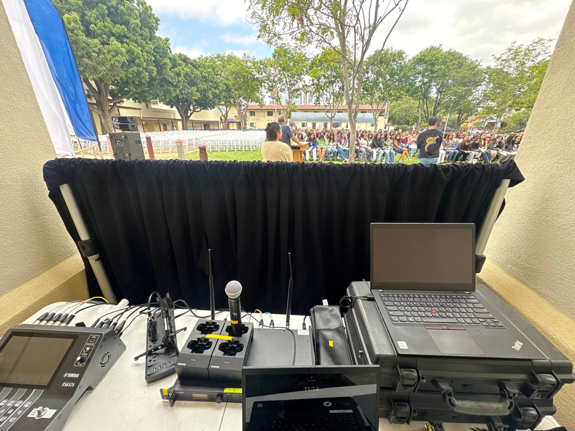 High-fidelity sound reinforcement and professional stage audio equipment setup for a corporate event venue.