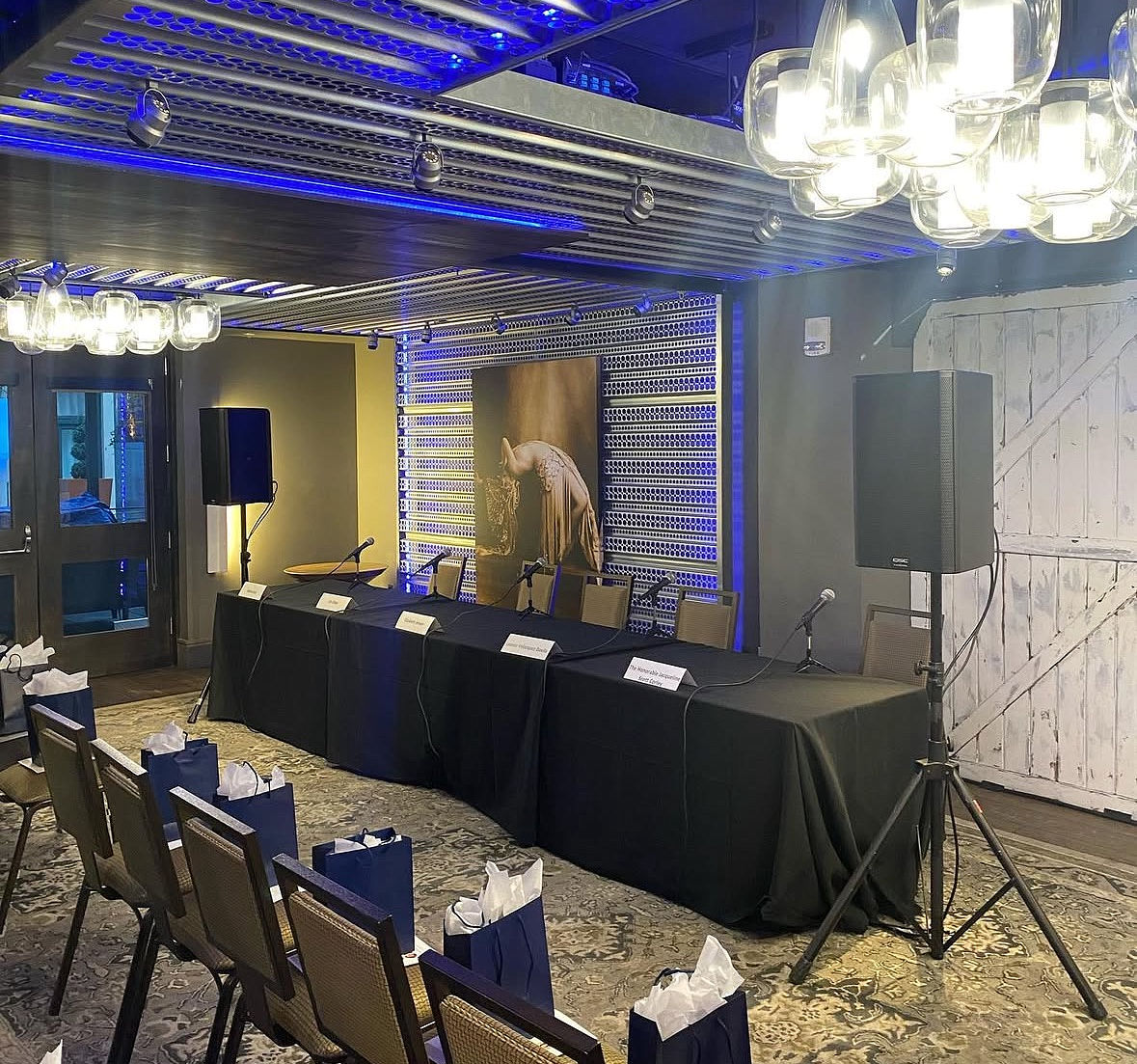 PTZ cameras, hardware switchers, and hybrid streaming control station deployed for a live-streamed corporate meeting.
