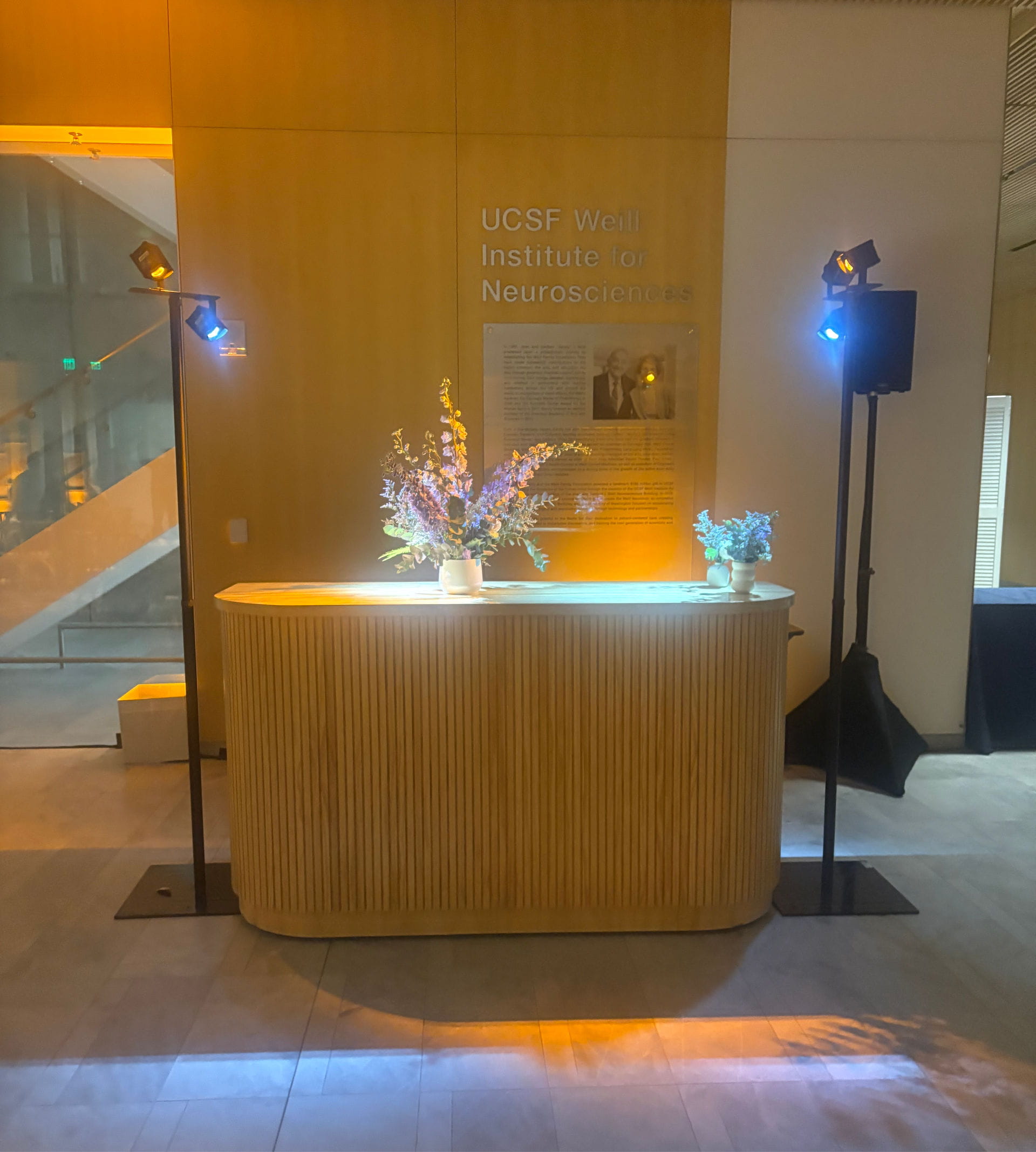 Dynamic architectural uplighting and custom stage wash production transforming a corporate event space.
